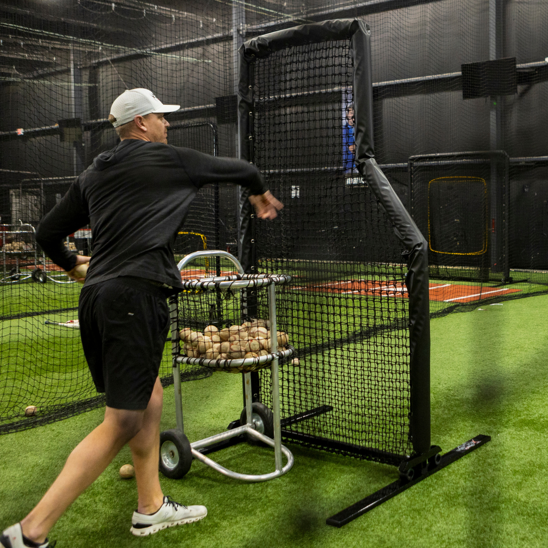 Parker Bridwell throwing a ball behind Web Flex Sports L-Screen