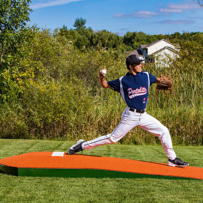 Man is Pitching on a portable mound from Portolite